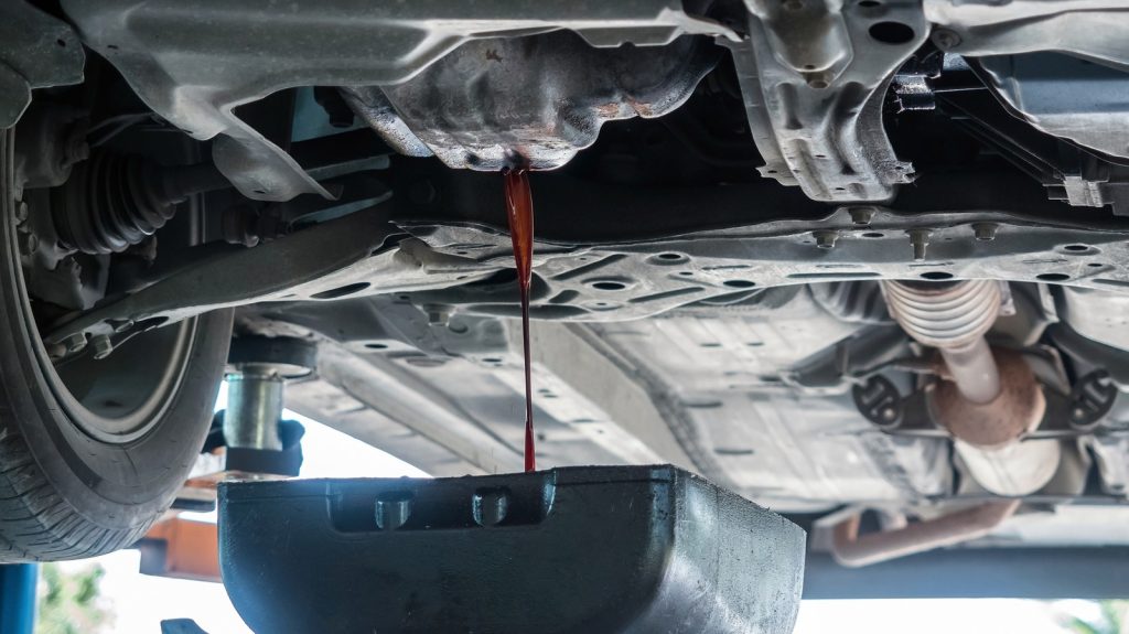 Why did car manufacturers switch to plastic oil pans?